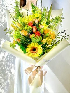 スタイリッシュ黄色オレンジ系花束